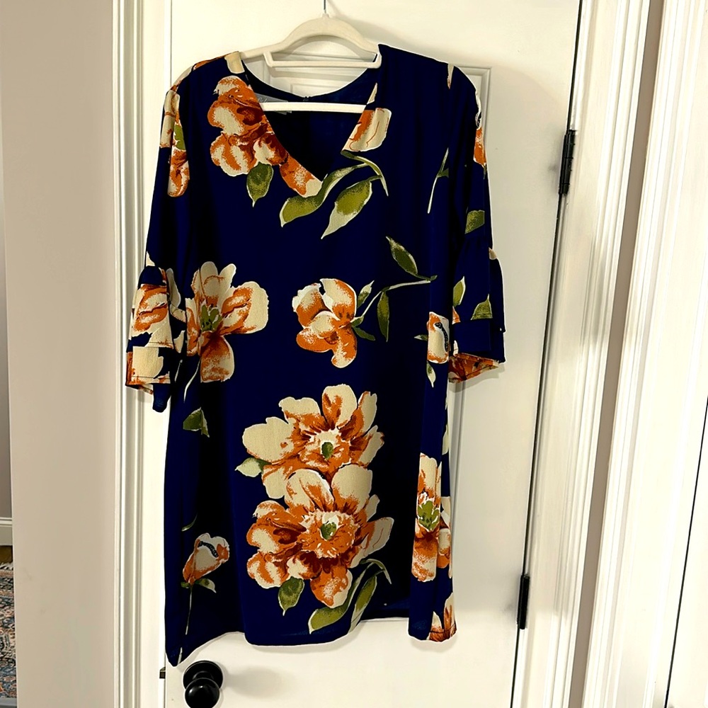 Navy blue great dress worn once. Beautiful flowers all over and bell sleeves